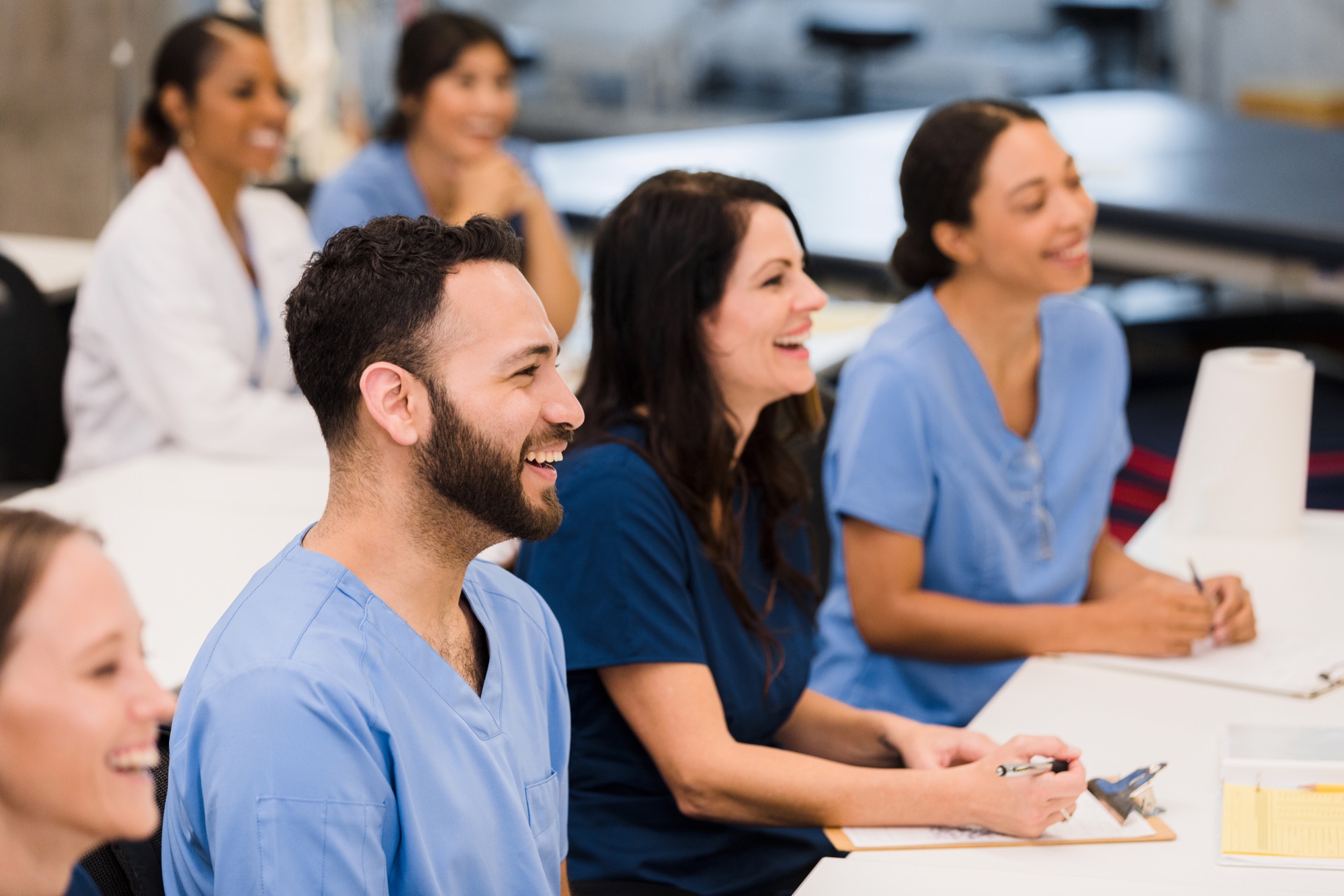 Diverse healthcare team engaged in a cross-cultural communication workshop